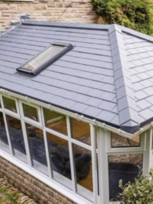 A completed roofing project by Southampton Roofing, showcasing a sleek, tiled roof with a skylight, part of roofing repairs.